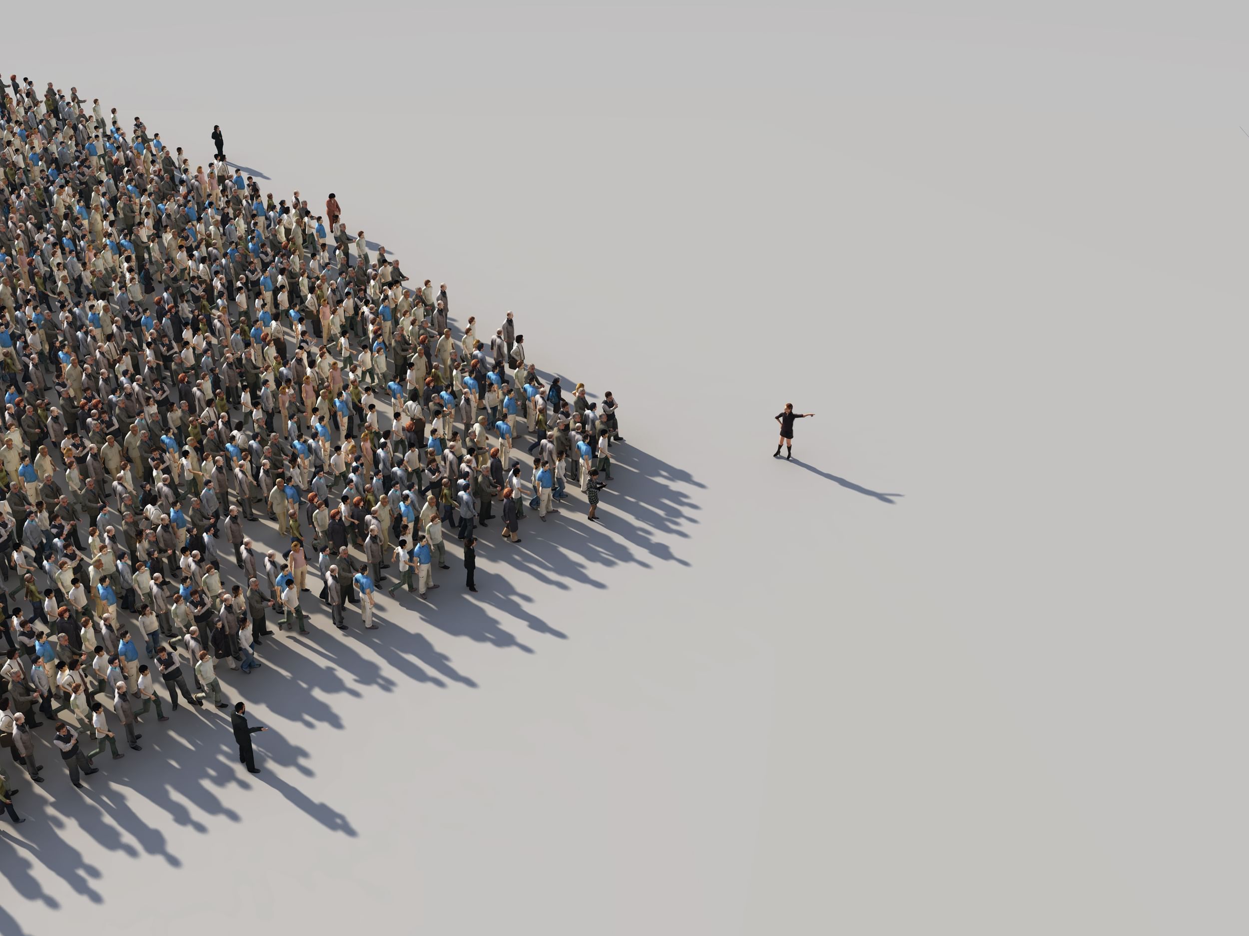 A large crowd of people looking to a leader for direction