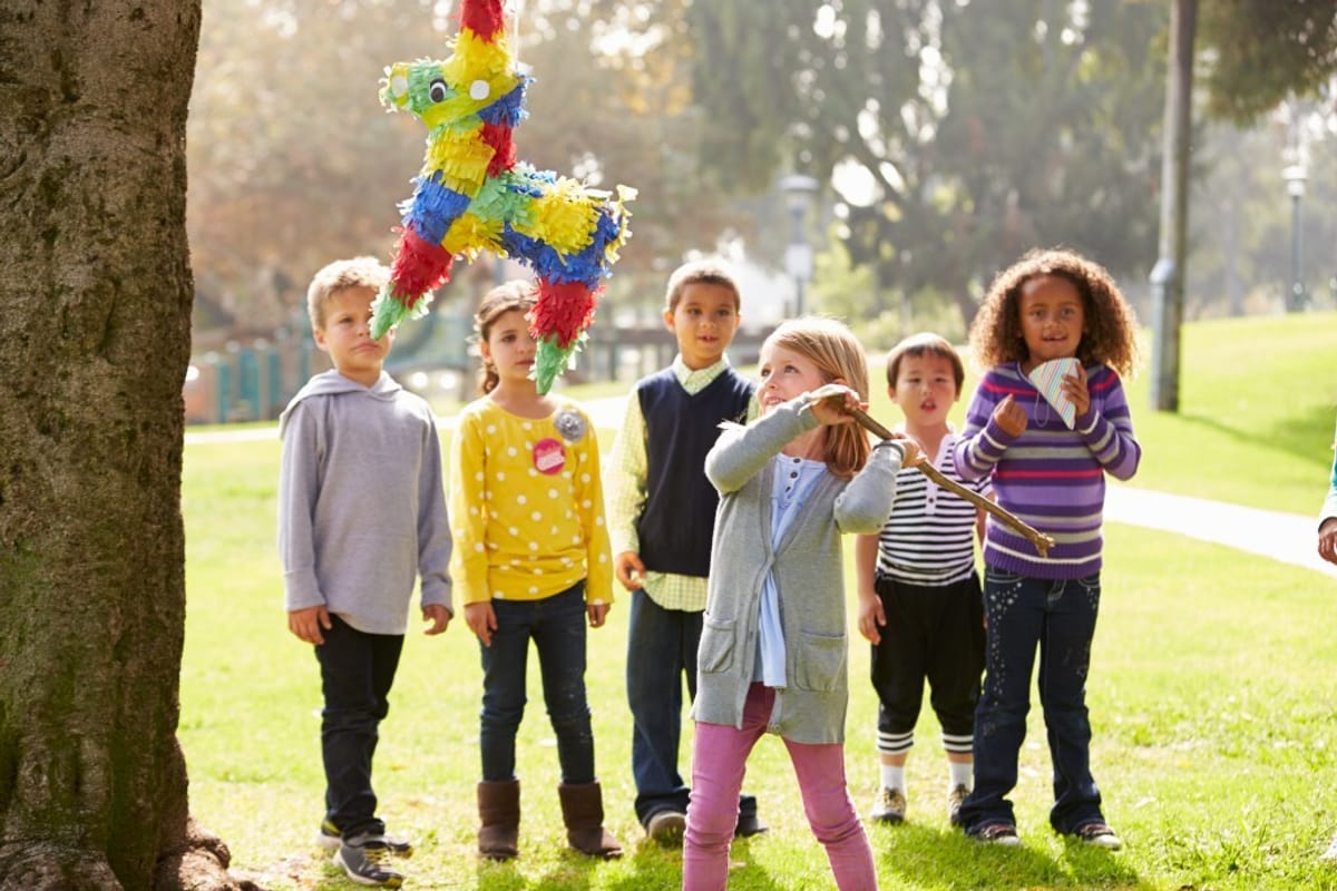 Children playing with a piñata