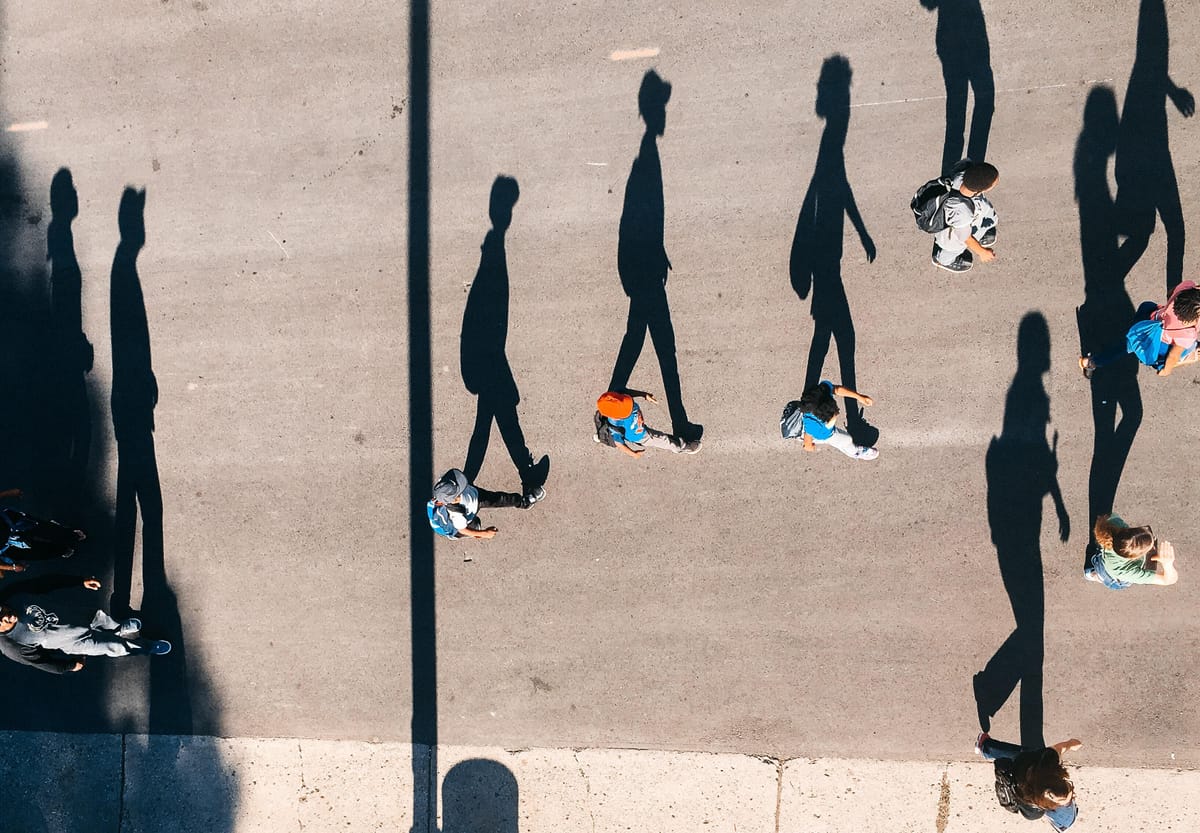 people in crosswalk by Tom barrett on unsplash